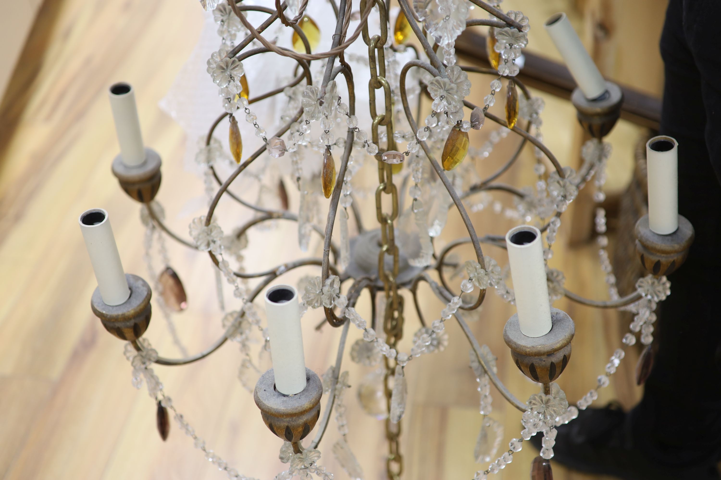 An eight branch glass drop chandelier